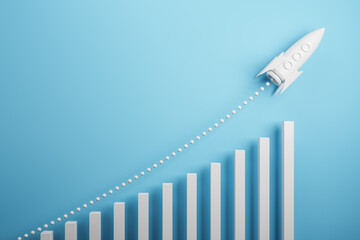 Startup and new project concept with white rocket flying up with dotted trajectory above light growth graph on blue background. 3D rendering - obrazy, fototapety, plakaty