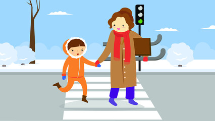 Mom and son hold hands and carry a sled in their hands and cross a pedestrian crossing