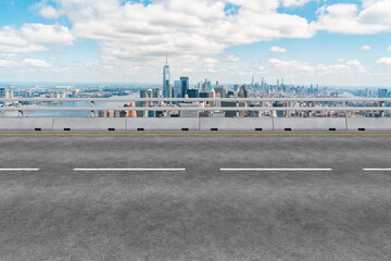 Fototapeta na wymiar Empty urban asphalt road exterior with city buildings background. New modern highway concrete construction. Concept of way to success. Transportation logistic industry fast delivery. New York. USA.
