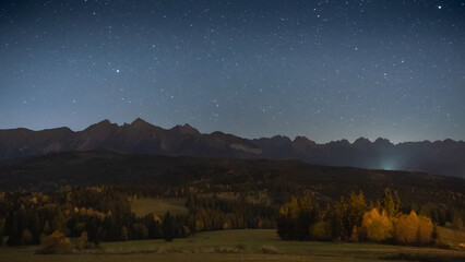 Beautiful night landscape with sky full of stars above rocky mountain range, Europe, Slovakia