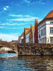 Water canal in Bruges, Belgium showing the bridges to which the city ows its name.