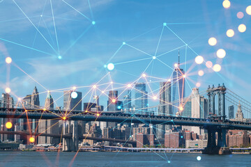 Fototapeta na wymiar Brooklyn and Manhattan bridges with New York City financial downtown skyline panorama at day time over East River. Social media hologram. Concept of networking and establishing new people connections