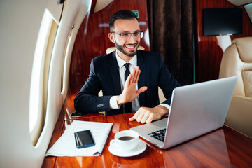 Businessman flying on his private jet.