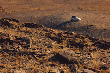 Travel offroad with car 4x4 mountains Altai or red sand Gobbi Mongolia, top view © Parilov