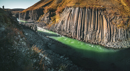 Fjadrargljufur basaltic canyon wide panorama with tourist