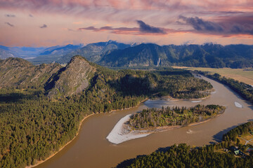 Beautiful sunrise landscape on meandering river Katun Altai Russia. Mountains in fog, blue sky aerial top view.