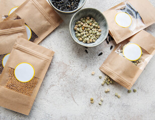 Microgreen seeds in paper bags and equipment for sowing microgreens.