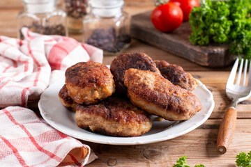 Pork cutlets from minced meat. Pan-fried meatballs. Healthy dinner for the family.