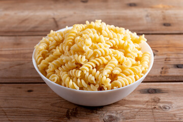 Pasta fusilli in plate on a table