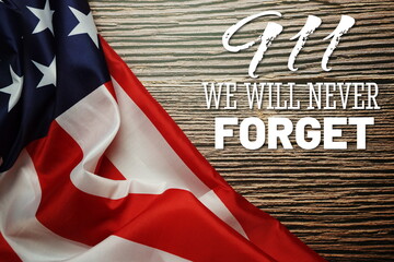 911 We will Never Forget  Word with USA flag on wooden background