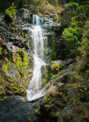 Fototapeta na wymiar Waterfalls in mid sunny day