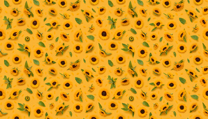 Seamless floral pattern of ornamental sunflower flowers, leaves buds and petals on yellow...
