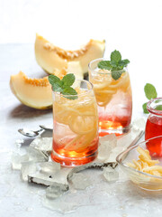 Es Blewah. Indonesian cold fruity drink of cantaloupe strips with syrup, basil seeds on top