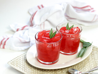 Manisan Kolang-Kaling, or preserved sugar palm fruit, tinted red, a traditional Indonesian typical refreshment and dessert during Ramadan month and in Idul Fitri or Hari Raya. Selective focus