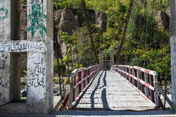 Fototapeta premium Wooden bridge over Hunza River in Hunza valley, Gilgit-Baltistan, Pakistan