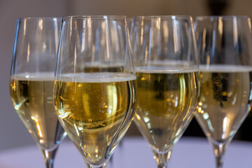 filled champagne glasses at a party