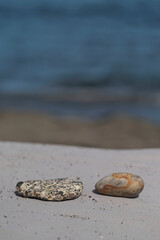 Fototapeta na wymiar Stones at the famous beach of Perissa in Santorini Greece