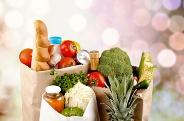 Shopping bag full of fresh groceries, grocery shopping concept on background