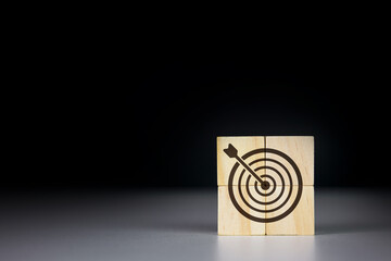 concept of achieving goals. Aims for success. target icon on wooden cubes with gray background, Copy space.