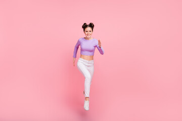 Fototapeta na wymiar Full body portrait of cheerful nice lady running toothy smile isolated on pink color background