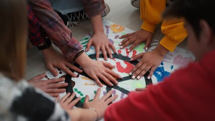 Cut out of students praying for peace in world at school.