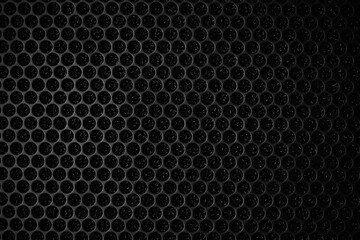 Safety net on the music speaker. Protective grid audio speakers. Close view of Black safety net. Metal perforated mesh, abstract pattern, Abstract black background. Professional audio equipment