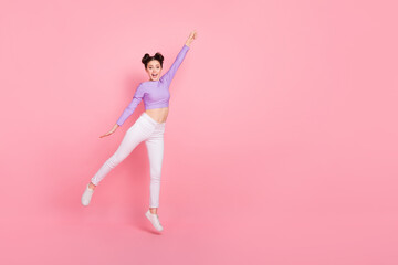 Fototapeta na wymiar Full body portrait of excited cheerful person raise arm empty space isolated on pink color background