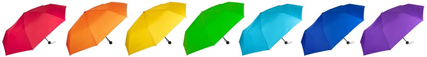 Set of rainbow colors umbrellas isolated on white background. Side view. © MadGladNat