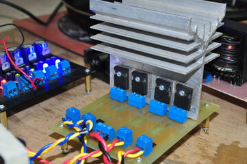 transistors attached to the heat sink to reduce heat. These transistors are used as current...