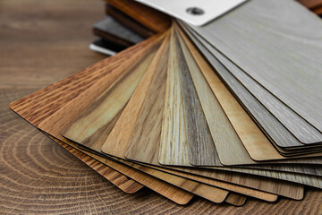 Sample of wood laminated chipboard for furniture design on wooden background with copy space. Color...