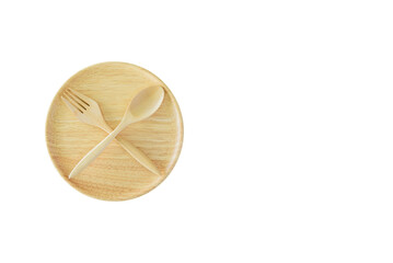 Intermittent fasting, diet and weight loss concept : Wood dish, spoon and fork in crossed position....