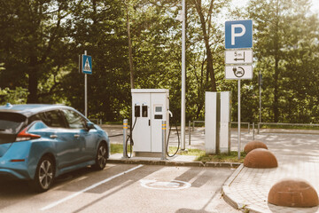 Young man unlocks an e-scooter with his mobile phone. Electric scooter new way city mobility. Green...