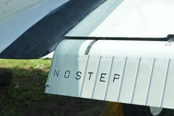 Close up image of an airfoil of an old aircraft.
