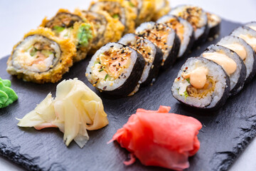 Sushi set grilled in tempura  on the stone plate