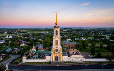 Fototapeta na wymiar Aerial views of Russian Golden Ring town Suzdal on a sunrise (aerial drone photo). Suzdal, Russia