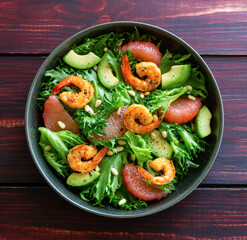 Salad with shrimp, grapefruit, avocado and nuts. Healthy eating. Diet.