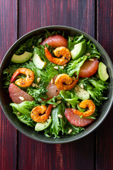 Salad with shrimp, grapefruit, avocado and nuts. Healthy eating. Diet.