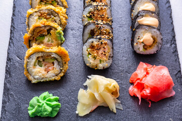 Sushi set grilled in tempura  on the stone plate