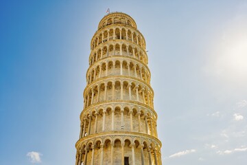 Leaning tower of Pisa, Italy, on a bright sunny day with blue sky