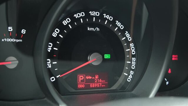 Dashboard of the car, close-up. Machine control. eco mode, flashing green light the driver is not wearing a seatbelt