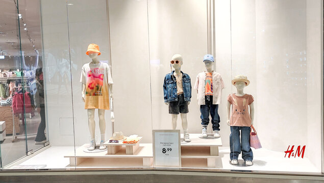 Poland, Bydgoszcz - April 28, 2022: HM shop. Children's mannequins in clothing store. Dummies show kids clothes
