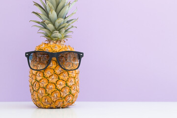 Creative pineapple with sunglasses isolated on color background, summer vacation beach idea design pattern, copy space close up