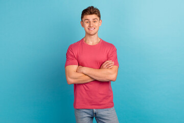 Photo of young handsome man crossed hands confident expert leader isolated over blue color background