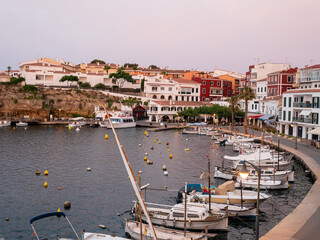 Boats moored in the small port of Cales Fonts in Es Catell, Menorca.