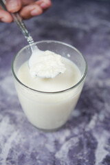 glass of whole cream milk on table , Cream of milk.