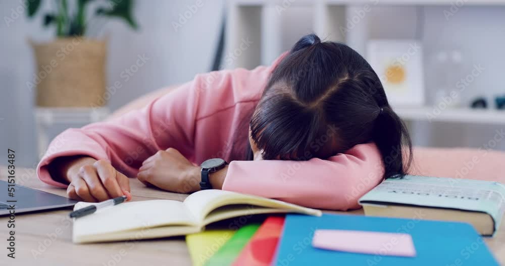 Poster tired student sleeping at her desk while studying for university or college exams and finals. exhaus