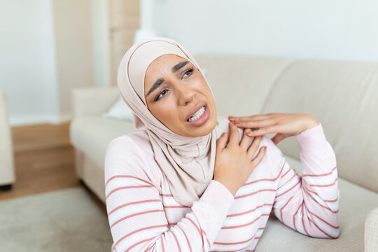 Pain in the shoulder. Upper arm pain, Arabic muslim woman with body-muscles problem, Healthcare And Medicine concept.