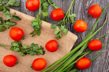 cherry tomato on wood background top view