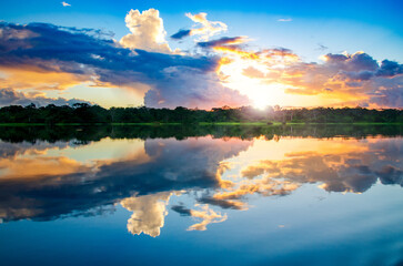 spectacular sunset over beautiful lake in peruvian rainforest - Reserva nacional Pacaya Samiria, Peru, Amazonia