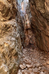 Passage  through the gorge to the ruins of the Monfort fortress, located on a high hill overgrown with forest, not far from Shlomi city, in the Galilee, in northern Israel